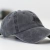 gray baseball cap on white surface