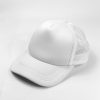 white baseball cap on white surface